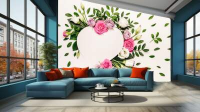 Valentine's day romantic concept. Creative floral heart made of white and pink roses and green leaves Wall mural