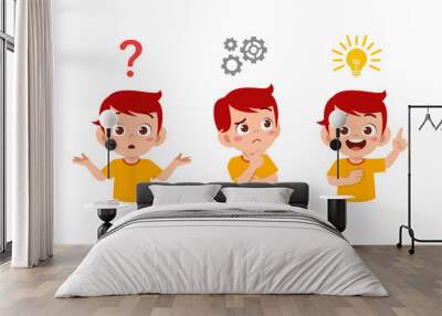 happy cute little kid boy thinking and searching idea process Wall mural