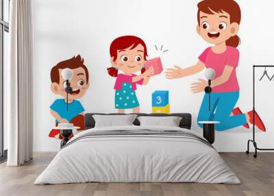 happy cute little kids boy and girl study with teacher Wall mural