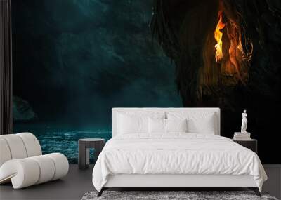 A burning torch illuminates a dark cave Wall mural