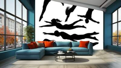 Male and female athlete acrobat jumping, swimming, snorkeling and diving sport action silhouette Wall mural