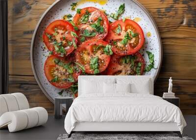 Photo of seasoned cooked and garnished tomatoes on a plate, on a wooden table 2 Wall mural