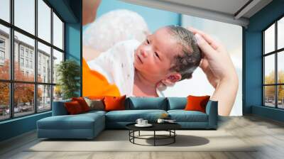 Asian newborn baby boy taking a shower and wash hair by mother in the bathroom, 9 days of life, child kid concept Wall mural