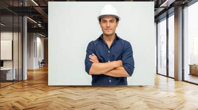 Handsome man industrial engineer wearing a white helmet solated on white background Wall mural