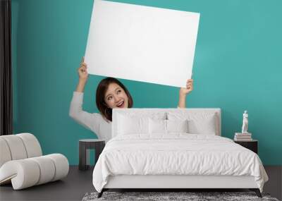 Young attractive asian woman showing and holding blank white board, Showing empty board for input your text Wall mural