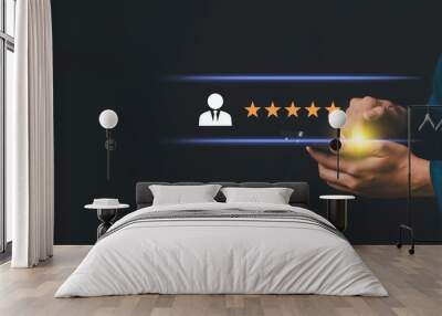 a business holding a smartphone, a user icon and representing a five-star rating. customer reviews, online ratings, or quality service. related to business, customer feedback, service excellence Wall mural