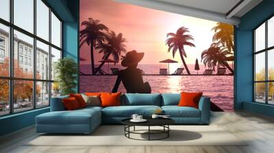 Woman in a hat at the resort. Wall mural