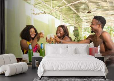 group of african friends having drinks at a bar Wall mural