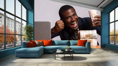 happy african businessman with a lot of cash Wall mural