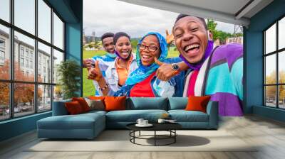 young black friends take a selfie together, feeling excited and happy Wall mural