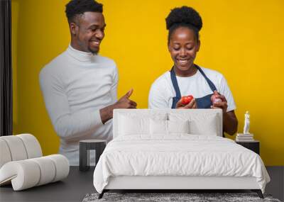 young black male and female chef cooking together Wall mural