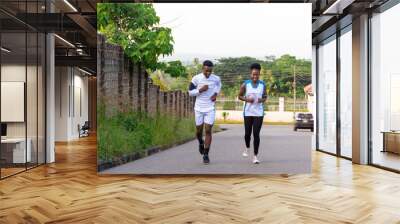 young man and woman going for a jog Wall mural