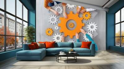 Minimalist photo of gears and puzzle pieces, concept illustration of teamwork and efficiency in the office Wall mural