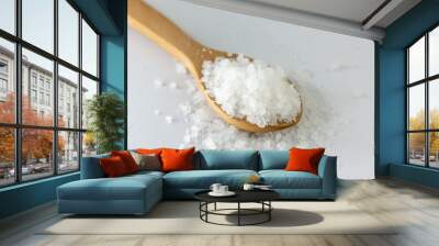 Organic rock salt in wooden spoon on white background. Transparent, healthy rock salt extracted in Turkey. Wall mural