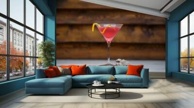 Fresh cosmopolitan martini with lemon twist on table with wood background Wall mural