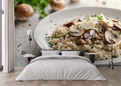 A plate of creamy risotto topped with sauteed mushrooms and parmesan cheese. Wall mural