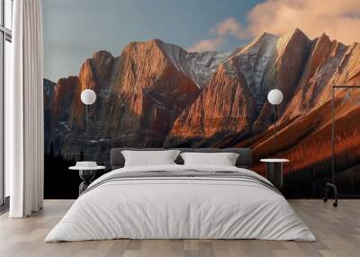 A stunning sunrise illuminates a majestic mountain range in the Canadian Rockies Wall mural