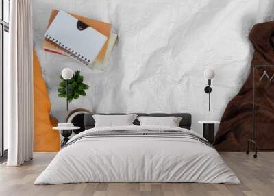 Coffee plant and pile of books on white bed. Morning mood. Wall mural