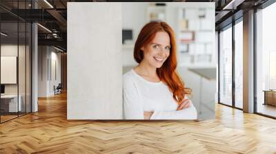 Astute shrewd young woman with a lovely smile Wall mural