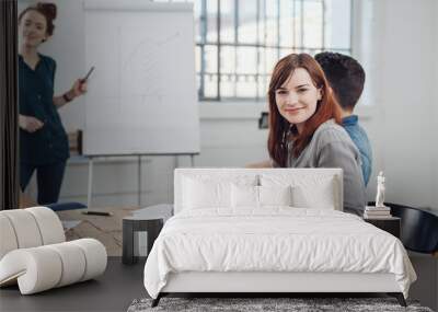 Attractive young businesswoman with a big smile Wall mural