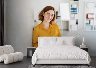 Attractive young office worker holding large file Wall mural