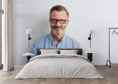 Bearded middle-aged man wearing glasses Wall mural