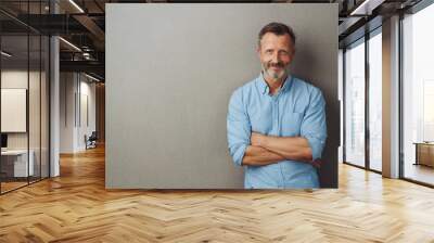 Bearded middle-aged man with a friendly smile Wall mural