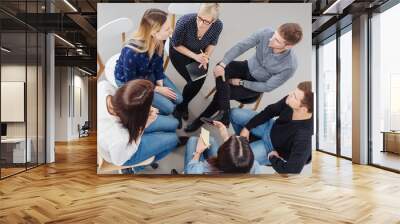 Group of people having a meeting together Wall mural