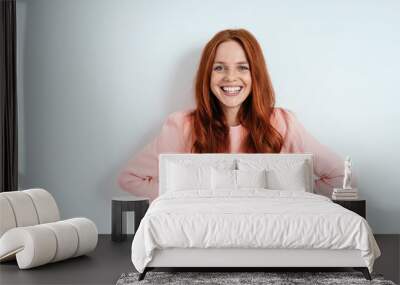 Happy confident young woman with a cheerful smile Wall mural