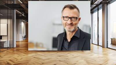 Middle-aged businessman wearing glasses Wall mural