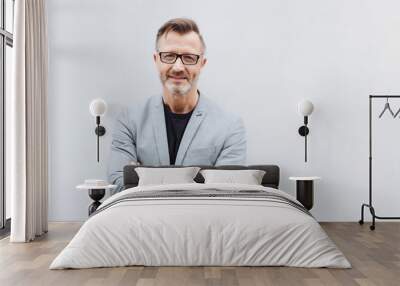 portrait of mature man with arms crossed Wall mural