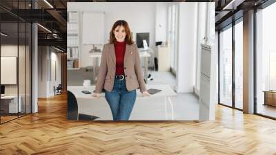 Smart confident young businesswoman Wall mural