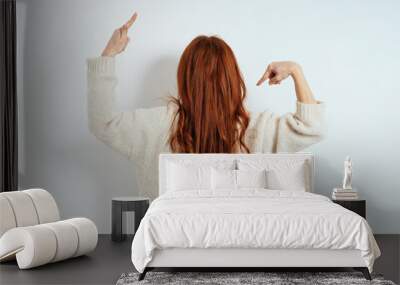 Young woman with long tousled red hair Wall mural