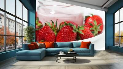 fruit yogurt in a glass jar and fresh strawberries, closeup Wall mural