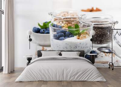 healthy breakfast with chia-pudding and fresh blueberries on white cutting board Wall mural