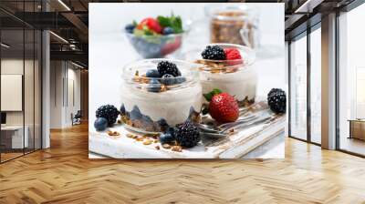 healthy creamy dessert with fresh berries on white background Wall mural