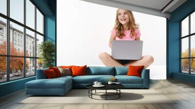 Carefree cheerful blond caucasian cute kid young sister sitting floor with laptop, laughing joyfully, studying online, digital education, look away left copyspace, smiling happy, learn new language Wall mural