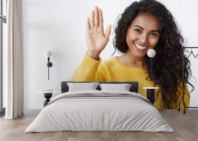 Girl giving high five, happy with productive team work. Cheerful curly-haired african american woman raise hand to congratulate friend with job well done, smiling supportive, white background Wall mural