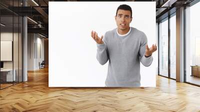 indecisive troubled hispanic boyfriend dont know what buy girlfriend for anniversery, raising hands  Wall mural