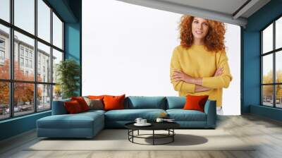 Portrait confident redhead caucasian curly woman in comfy winter yellow sweater, cross hands over chest, look intrigued and focused on conversation, have dialogue, standing assertive Wall mural