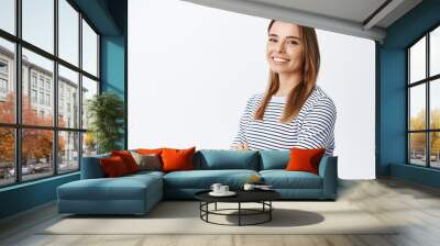 Portrait of confident smiling woman, cross arms on chest with determined face and looking at camera, standing against white background Wall mural