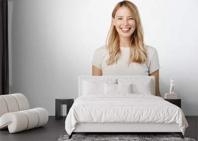 portrait of happy smiling woman showing white smile, laughing and looking carefree at camera, standi Wall mural