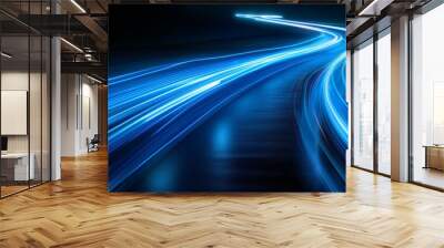 Bright blue light trails curve dynamically against a dark Wall mural