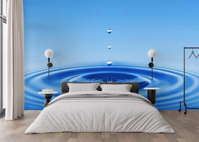 Image of a water drop on a blue background. Wall mural