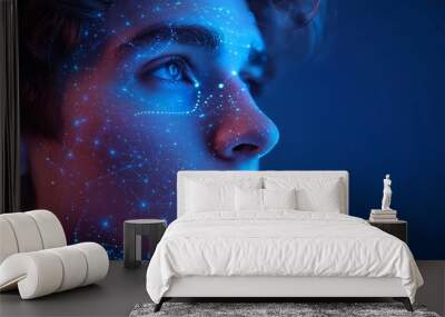 A man with digital facial recognition overlays on a blue backgro Wall mural