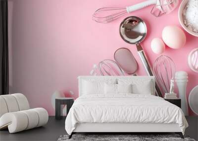 A flat lay of baking supplies in a pink color scheme. Wall mural