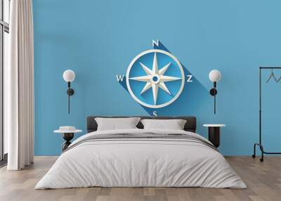 Compass with long shadow on blue background. Wall mural