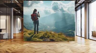 Woman hiking and checking GPS maps location on mountains in adventure, wellness and health with nature and cityscape. Person with backpack and trekking photography on green hill, travel or eco friendl Wall mural