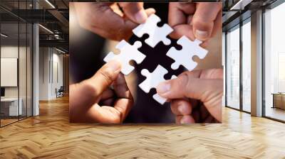 Group hands with puzzle for solution, teamwork and workflow goals, achievement and success in closeup. Team building game, project development and people for problem solving, synergy or collaboration Wall mural