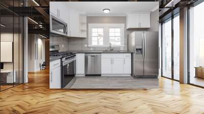 Kitchens in white new, with granite counter-tops, stove and stainless steel refrigerator. Wall mural